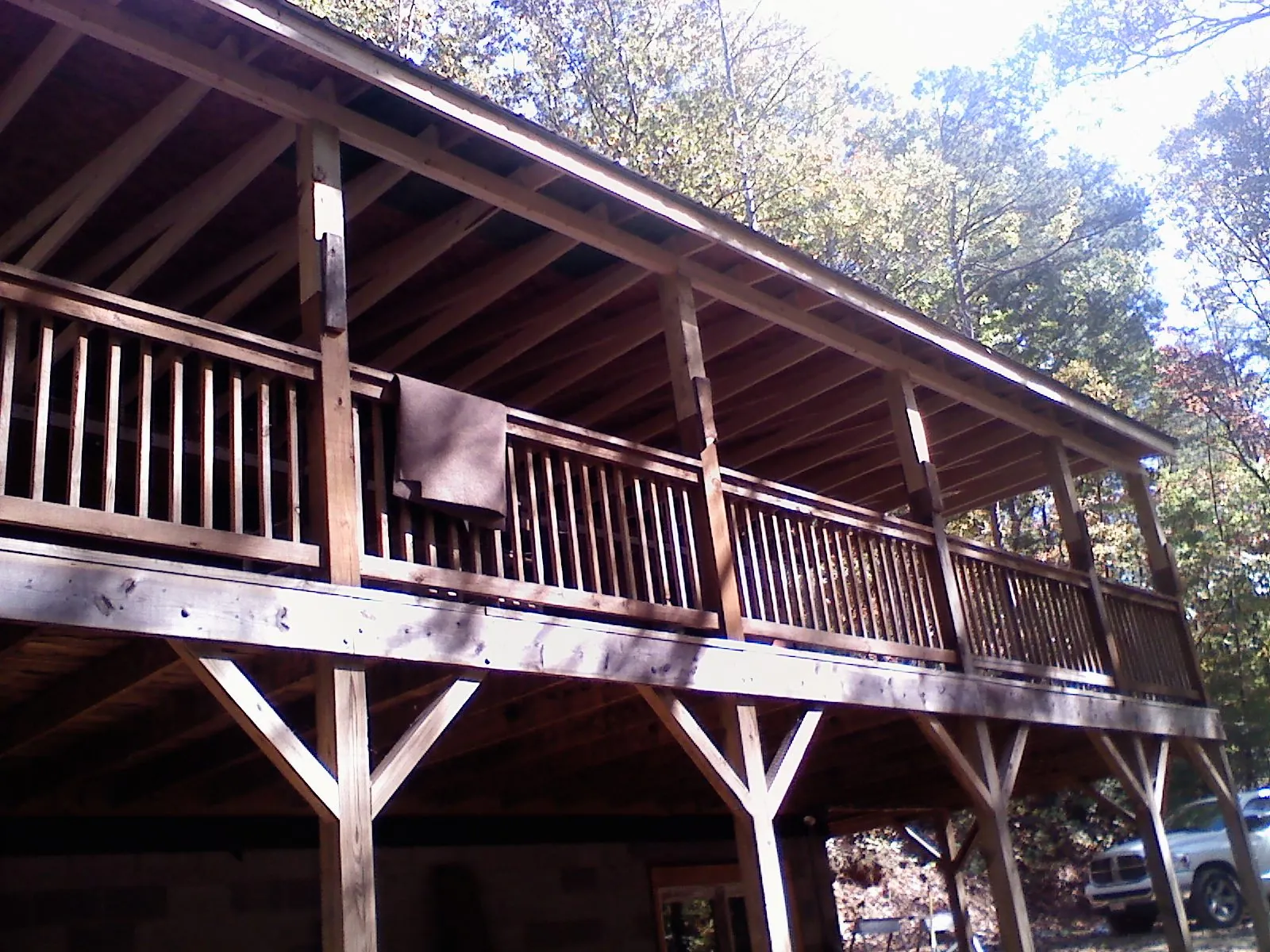 Timber framing under a new elevated porch and deck — Roof Leak Repair in Orchard Park by Roofing Brothers